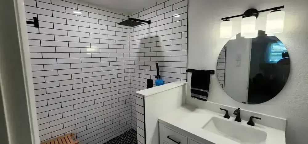 Green tile and terrazzo shower by BNB Concepts