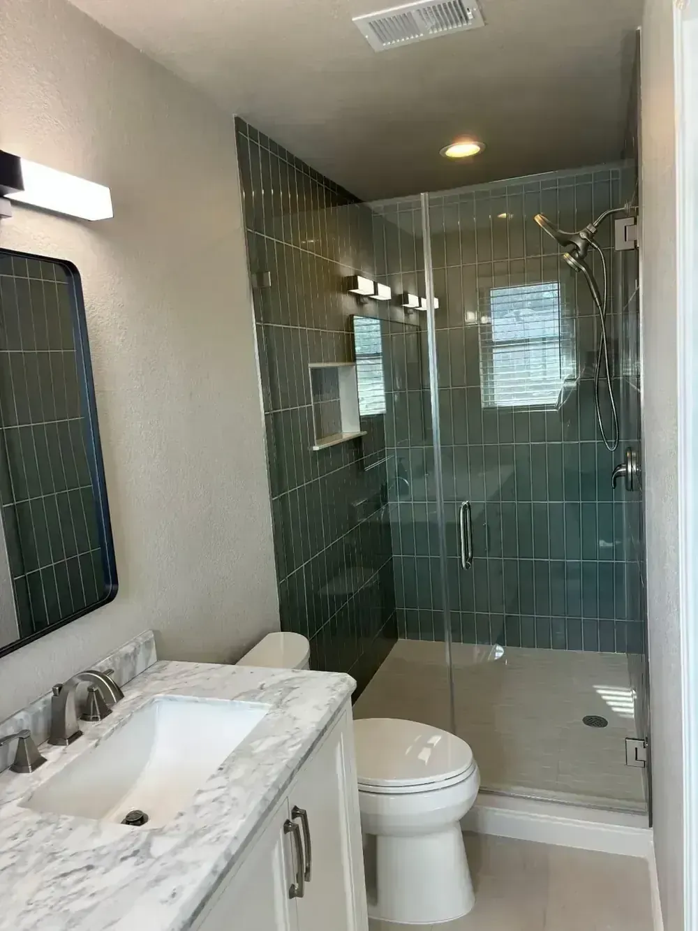 Green Tile Shower and Marble Vanity by BNB Concepts