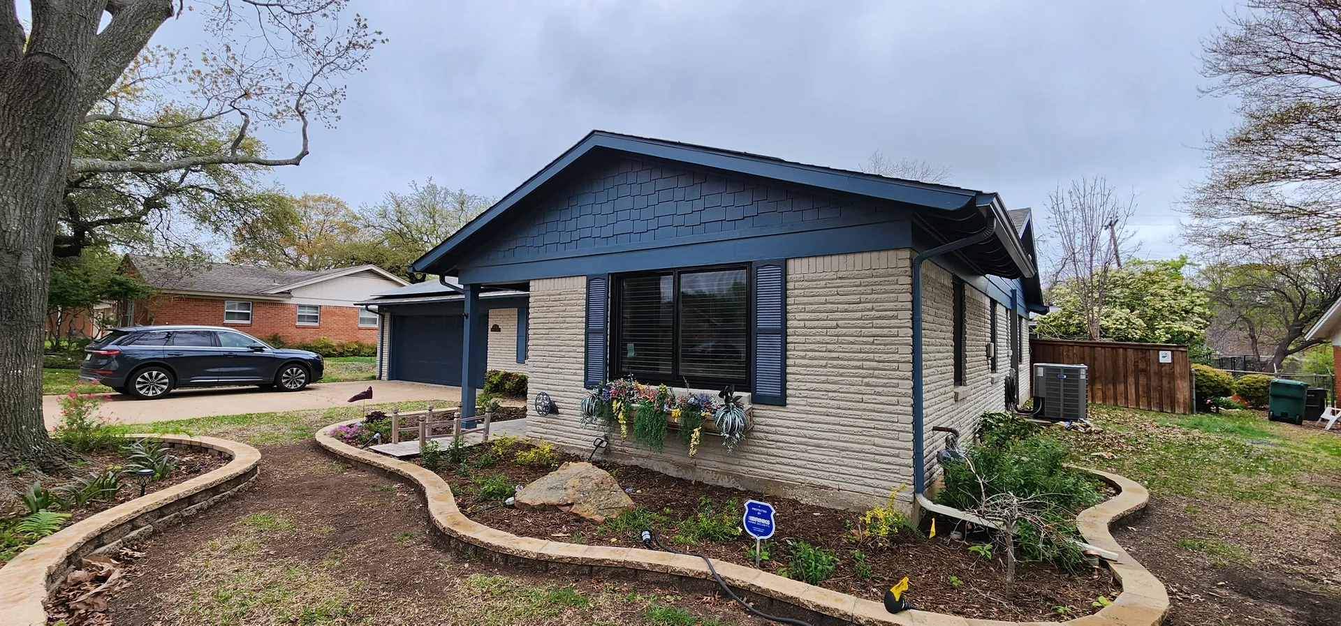 Fully remodelled home exterior with fresh paint and landscaping by BNB Concepts